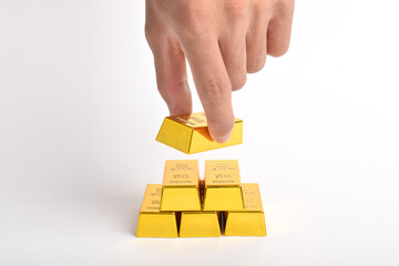 Gold bars with business hands. The concept of financial wealth, investment and trade.