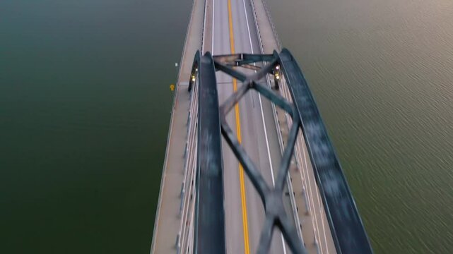Aerial view flying along the empty Lake Champlain Bridge, sunset in Vermont, USA