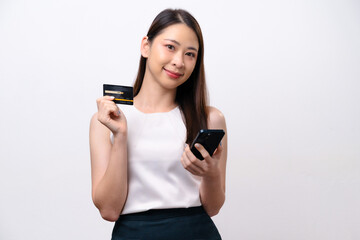 Naklejka premium A woman is holding a credit card and a cell phone