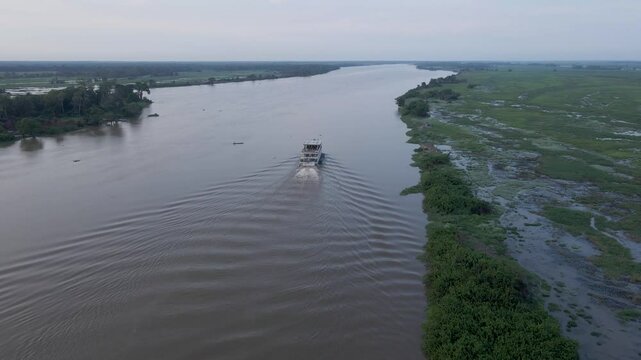 Aerial view of the cruise ship crossing the congo basin rainforest in the democratic republic of Congo.