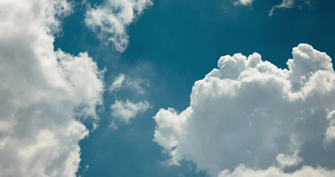 Timelapse of puffy clouds being blown by a strong wind