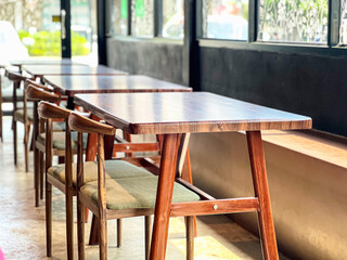 Wooden Tables and Chairs in Modern Coffee Shop, Cozy Interior Design, Sunlight Reflection, Contemporary Style