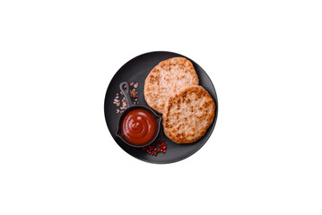 Grilled chicken burger cutlet with salt, spices and herbs