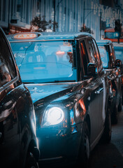 Taxis & London Buses Along With Christmas Decorations At Dusk In Oxford Street, London
