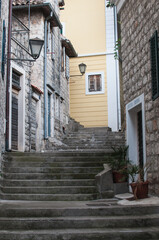 Narrow street with steps in the old town of Herceg Novi, Montenegro. 