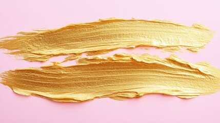 Golden brush strokes elegantly layered on a soft pastel pink backdrop, showcasing a unique hand-painted dry brush technique.