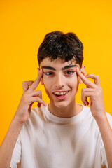 Smiling teenager thinking, with stretched eyes.