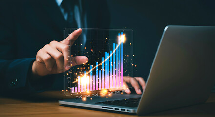 Business Growth Visualization: A businessman's hand gestures towards a holographic graph depicting a rising line chart, symbolizing progress and success.