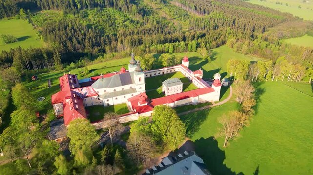 Discover the serene beauty of the Church of the Assumption of the Virgin Mary in Kraliky, Czechia. This site is a significant pilgrimage destination surrounded by lush nature.