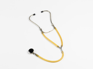 Yellow Stethoscope Isolated on White Background – Medical Instrument for Healthcare and Diagnostics