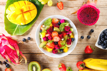 delicious mixed fruit salad with dragon fruit (pitaya), mango,banana and blueberry. healthy eating