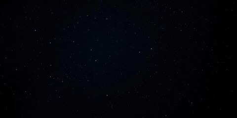 Darkness of the night sky with a multitude of twinkling stars against a deep black background, glittering galaxies, starry night scene, darkened cosmos