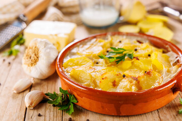baked potato with cream and cheese- homemade potato gratin