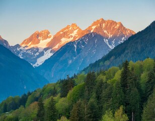Obraz premium Majestic Mountain Scenery with Sunrise Glow and Vibrant Forested Slopes
