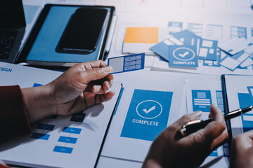 Young Asian business creative team work together, mobile application software design project. Brainstorm meeting, internet technology, smartphone web app designer, office coworker teamwork concept