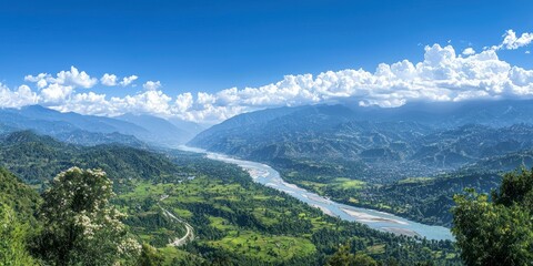 Fototapeta premium A sweeping landscape view of mountains, valleys, and rivers under a clear blue sky, with nature in full bloom.