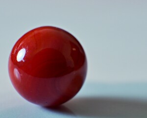 Closeup on a colorful marble on a white background

