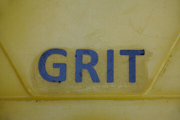 Grit salt for road surfaces during icy cold weather. Road safety in winter