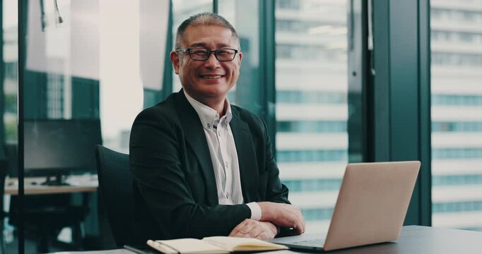 Laptop, face and business with Japanese man in office for financial advisor, credit portfolio or account manager. Planning, networking or digital report with mature person in corporate firm for admin