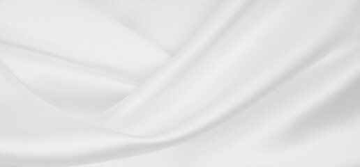 Smooth elegant white silk or satin luxury cloth texture as wedding background. Luxurious background design