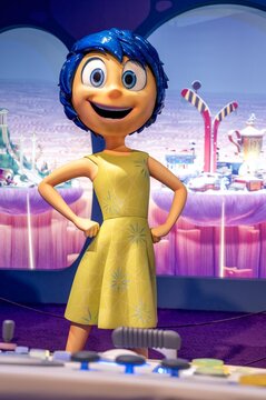 Madrid, Spain; 05-14-2024: Joy character from the Pixar movie Inside Out that represents the mood and emotions of a teenage girl made a large figure for an exhibition