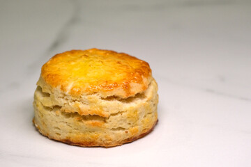 Scone on a white marble worktop.