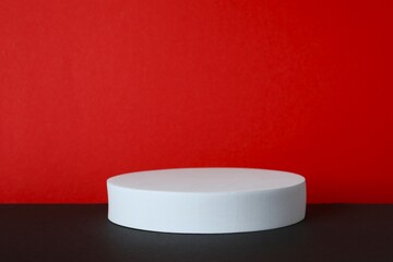 White podium on two tone background