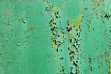 The texture of the old green paint wall background