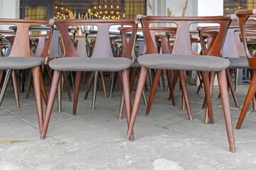 Many Brown Wood Chairs With Textile Seats in Restaurant Storage