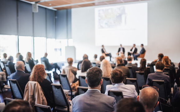 Interview and round table discussion at business convention and presentation. Audience at the conference hall. Business and entrepreneurship symposium.