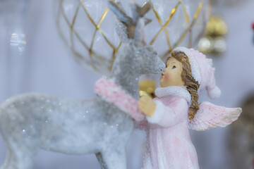 Fototapeta premium Little angel with deer Christmas decoration