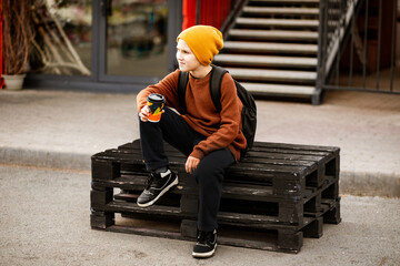 Young person enjoying autumn day in urban setting
