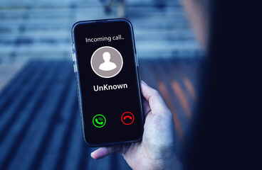 Smartphone incoming call notification. concept of scammers or strangers, fraud, and contact to sell...