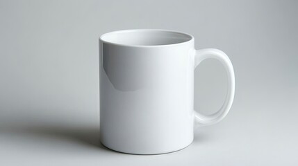 White ceramic mug on isolated light grey background.
