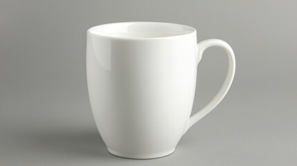 Obraz premium White ceramic mug on isolated light grey background.
