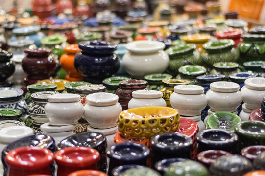 Colorful ceramic pots beautifully arranged at a market