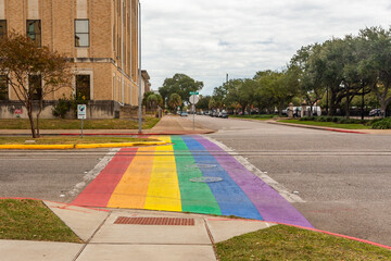 Rainbow street crosswalk in the downtown, the art of the rainbow flag installed to celebrate the LGBTQ community. Galveston, Texas