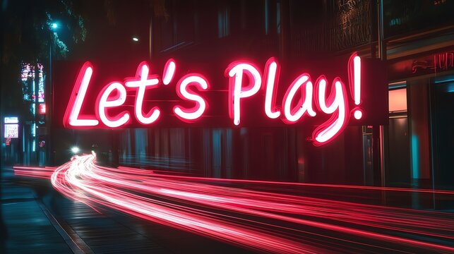 A neon sign reading "Let's Play!" hangs over a city street at night. Light trails from cars traveling in the street. - Powered by Adobe