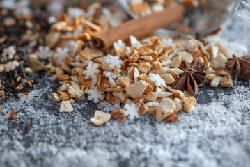 winter hot drink ingredient spilled on table on snowy background