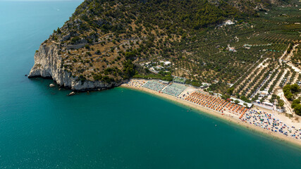 Aerial view of Mattinata beach, in the province of Foggia, Puglia, Italy. There are many beach...