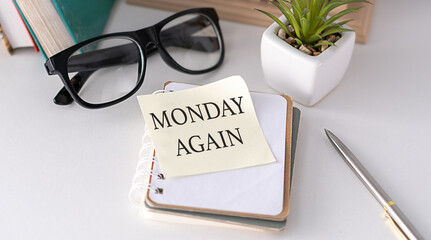 Monday again - motivational reminder handwritten on sticky note