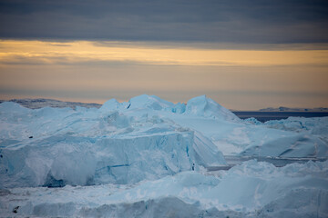 Icebergs in Ilulissat, Greenland in early winter © zheng