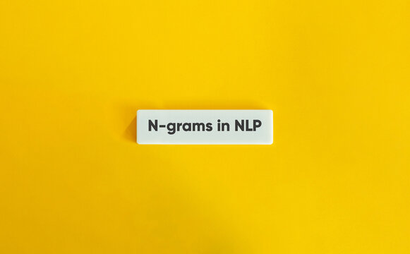 N-grams in NLP (Natural Language Processing). Text on Block Letter Tile on Yellow Background. Minimal Aesthetic.