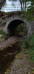 Pedestrian bridge over a tributary of the Bobr River, Jelenia Gora, Poland. Autumn landscape © PRO Balance