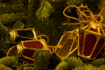 Beautiful festive decorations on the Christmas tree. Close-up. Beautiful Christmas background. The concept of decorations and decor for the new year. New Year's card 2025.