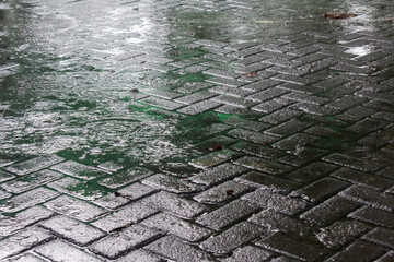 Rainwater Wetting the Surface of Parking Lot Paving