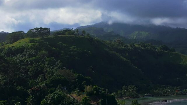 Road to Teahupoo vista point Taiarapu Matiti Taravao village barrier coral reef South Pacific Ocean French Polynesia aerial drone tropical jungle Mont Rooniu Orohena morning circle right motion