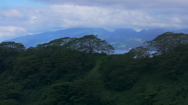 Big Tahiti Island vista point Taiarapu Matiti Taravao village barrier coral reef South Pacific Ocean French Polynesia aerial drone tropical jungle Mont Rooniu Orohena Papeete morning forward reveal