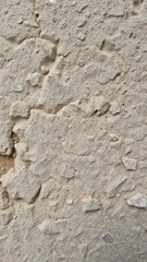 A close-up photo of rough and weathered textured stone surface, design