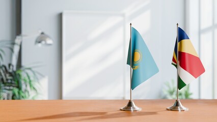 FLAGS OF KAZAKHASTAN AND SEYCHELLES ON TABLE